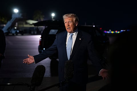 President Donald Trump speaks to the press before boarding Air Force One at Palm Beach International Airport in West Palm Beach, Florida on Sunday, November 16, 2025.