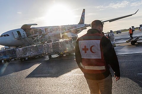 A member of the International Federation of Red Cross and Red Crescent Societies (IFRC) team watching the loading of the humanitarian cargo for the people of Gaza