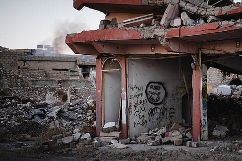 Islamic State graffiti in the ruins of Sinjar in July of 2019, following war with the Islamic State
