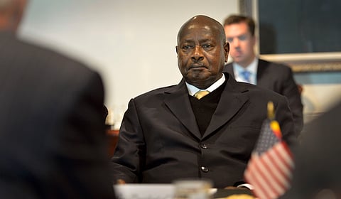 Uganda's President Yoweri Museveni listens as Secretary of Defense Chuck Hagel makes opening comments during a meeting at the Pentagon September 27, 2013.
