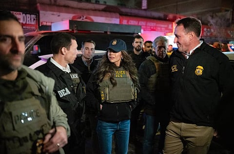 U.S Homeland Security Secretary Kristi Noem, center, dressed up in Immigration and Customs Enforcement gear joins a raid during an immigrant removal operation, 28 January 2025.
