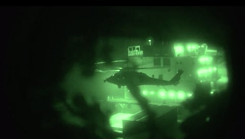 US Marines from the 31st MEU fast-roping from helicopters off the USS Tripoli (LHA-7) to seize the Iranian-flagged container ship M/V Touska.