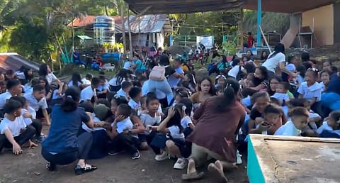 Powerful 7.8 magnitude earthquake shakes Philippine school during flag ceremony as teachers calmly guide students to safety.