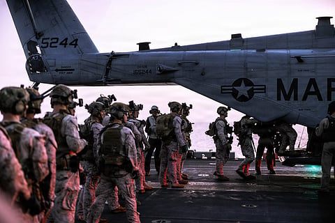 U.S. Marines assigned to Maritime Raid Force, 31st Marine Expeditionary Unit, conduct fast rope training aboard USS Tripoli (LHA 7) in the Arabian Sea / Image for illustrative purposes.