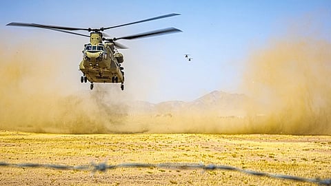A U.S. Army CH-47 Chinook helicopter prepares to land in the Middle East.