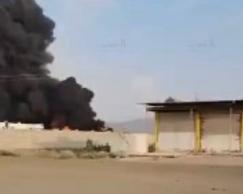 Large plumes of smoke rising from the Yemen Petroleum Company’s Al-Sabaha Central Station in Sanaa following a Saudi airstrike.