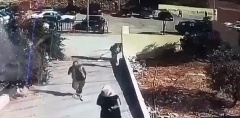 Surveillance footage of gunmen arriving by car and opening fire outside a Greek Orthodox church in Hammoud, Karak governorate, Jordan.