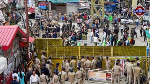Security personnel keep vigil after prohibitory orders were imposed in the Sanjauli locality following escalating tension over illegal construction in a mosque and call for a bandh by Hindu organisations, in Shimla on Wednesday, Sept 11, 2024.