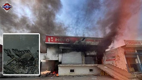 Protesters set fire to bike showroom