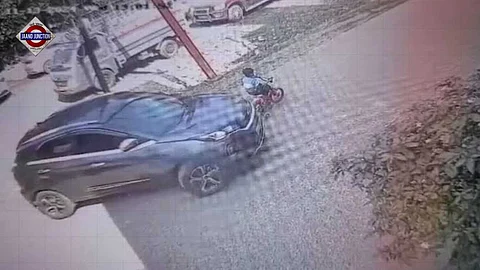 Boy suffers minor injuries to his leg after car runs over him.