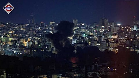 Smoke billows over Beirut's southern suburbs, after an Israeli strike.