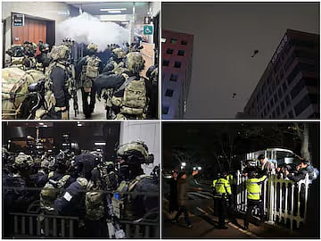 Helicopters fly, after South Korean President Yoon Suk Yeol declared martial law, in Seoul, South Korea. Police officers block the entry to the National Assembly.