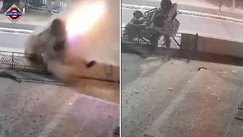 The SUV flipped multiple times before landing upside down in front of a car showroom.