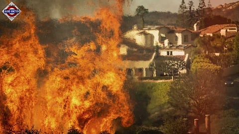 Massive wildfire rages through Los Angeles hillside, forces 30,000 to evacuate.