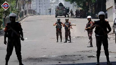 Bangladesh Army members stand in guard in Dhaka.