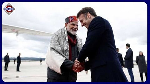 French President Emmanuel Macron shakes hands with Indian Prime Minister Narendra Modi after a departure ceremony.