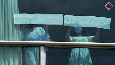 'Help us' signs on windows of Panama hotel holding Indian deportees from US