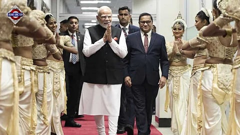 PM Modi greets dancers upon his arrival in Colombo on Friday.