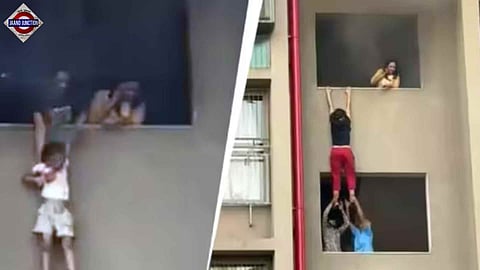 Child dangles in air after fire at high-rise.