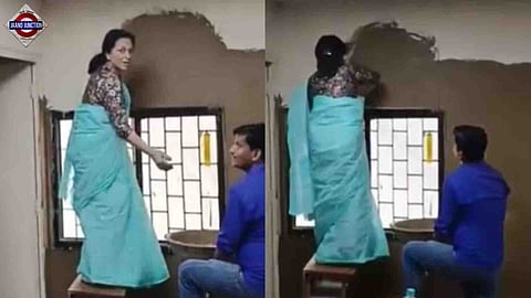 Delhi University's Laxmibai College principal seen applying cow dung on classroom walls.