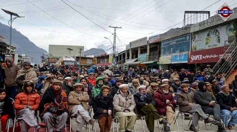 Residents stage a sit-in protest against power outages as they block the Karakoram Highway in Hunza Valley, in Pakistan's mountainous Gilgit-Baltistan region, on January 6, 2025.