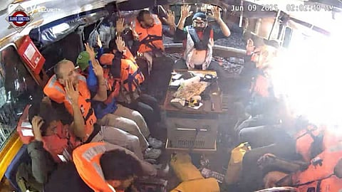 One of the crew members said they were arrested in international waters.