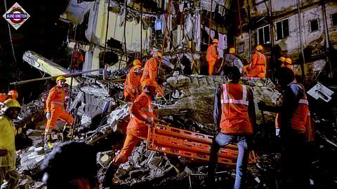NDRF personnel during a rescue operation after the rear portion of a four-storey building crashed onto a chawl at Virar of Vasai taluka, in Palghar district.