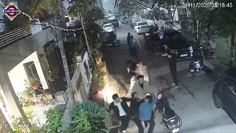 Assailants are seen beating up a few men inside a gated colony.