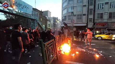 Residents in Tehran shouted from homes and rallied on the streets as demonstrations spread, marking a new escalation in nationwide unrest as demonstrations entered their 12th day.