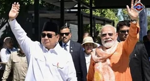 Prime Minister Narendra Modi receives a traditional angklung from Indonesian President Prabowo Subianto during his visit to Jakarta, where the two leaders also played the melody of Kuch Kuch Hota Hai.