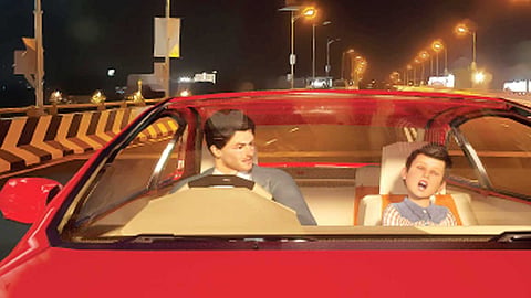 a man and his son ride the car on the highway road