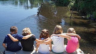 four children enjoy the nature view