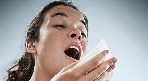 Girl with sneezing