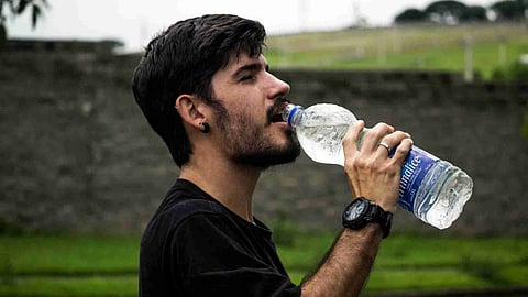 Man Drinking Ice Water