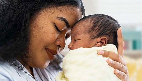 Child in mother's embrace