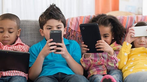Children Using Phone