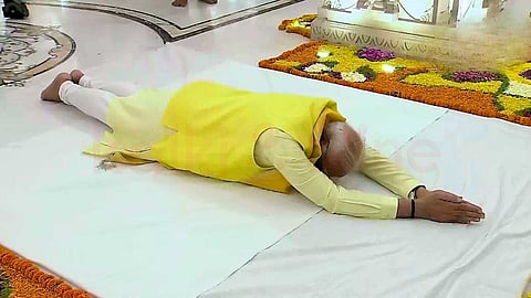 Prostrate on the ground in the temple