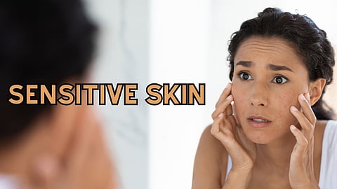 A woman looking her face in the mirror