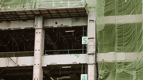 green net around construction building