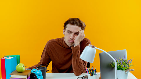 tired boy with closing eyes