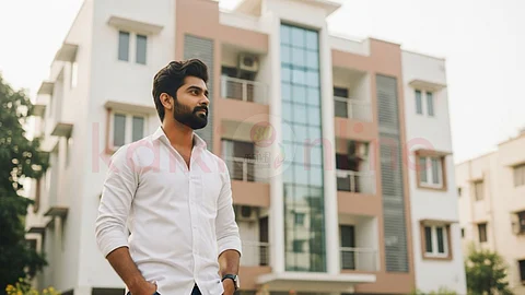 A man in front of apartment