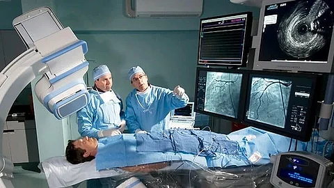doctors examing patient using hi tech equipment