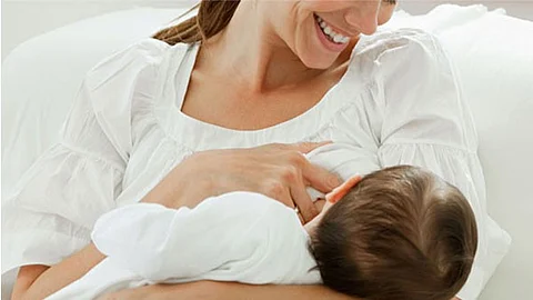 Breast feeding mother and baby