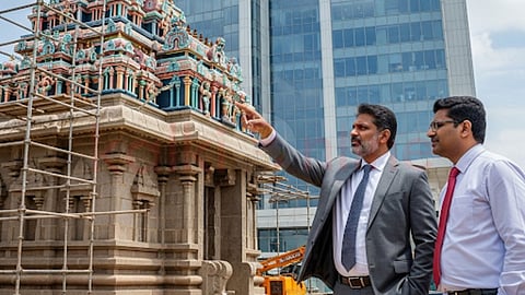 2 men in front of temple