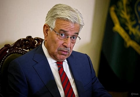 Khawaja Asif, Pakistan's Defence Minister, looks shocked in a blue suit