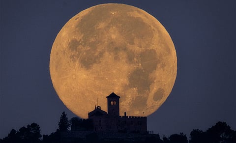 Bright supermoon rising close to Earth in November sky