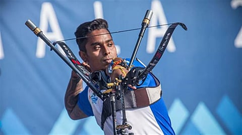 Indian archer aiming during India’s gold medal victory