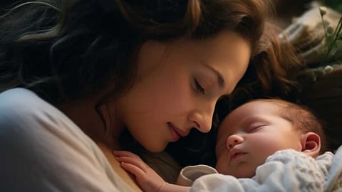 Mother putting her child to sleep