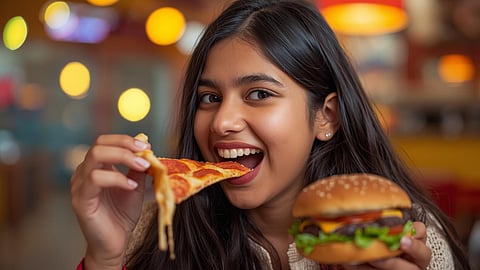 teen age girl eat pizza