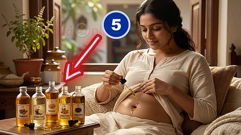 applying oil in belly button